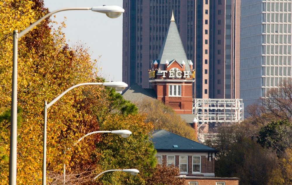 image of tech tower with lamp posts in front