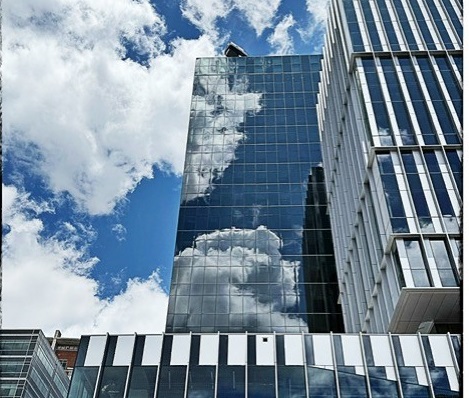 clouds reflecting off the new Tech Square Phase 3 building
