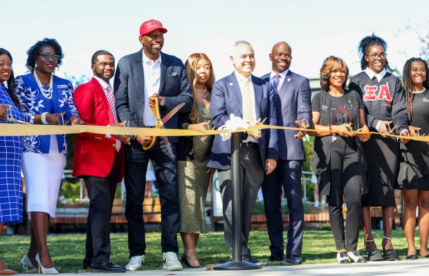 Group photo of the President and Mayor of Atlanta at Divine Nine ribbon cutting